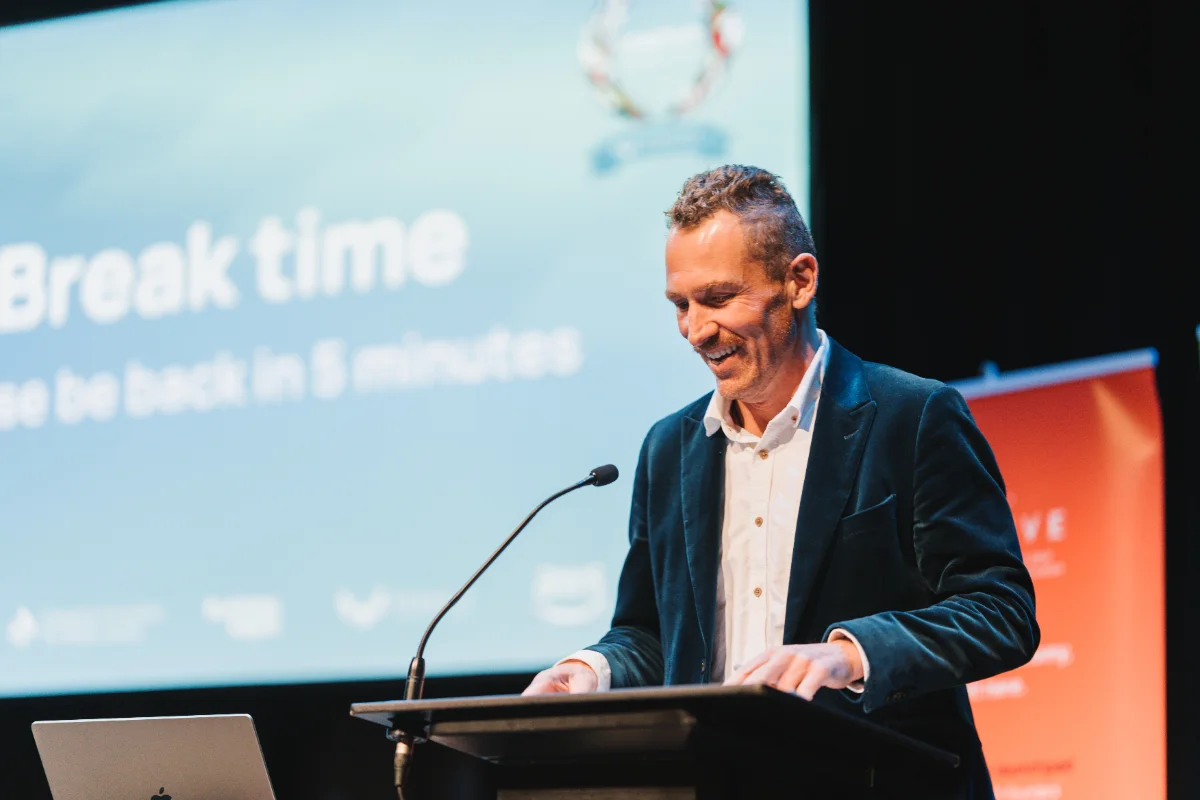 Trent on stage as MC of the 2025 Startup World Cup