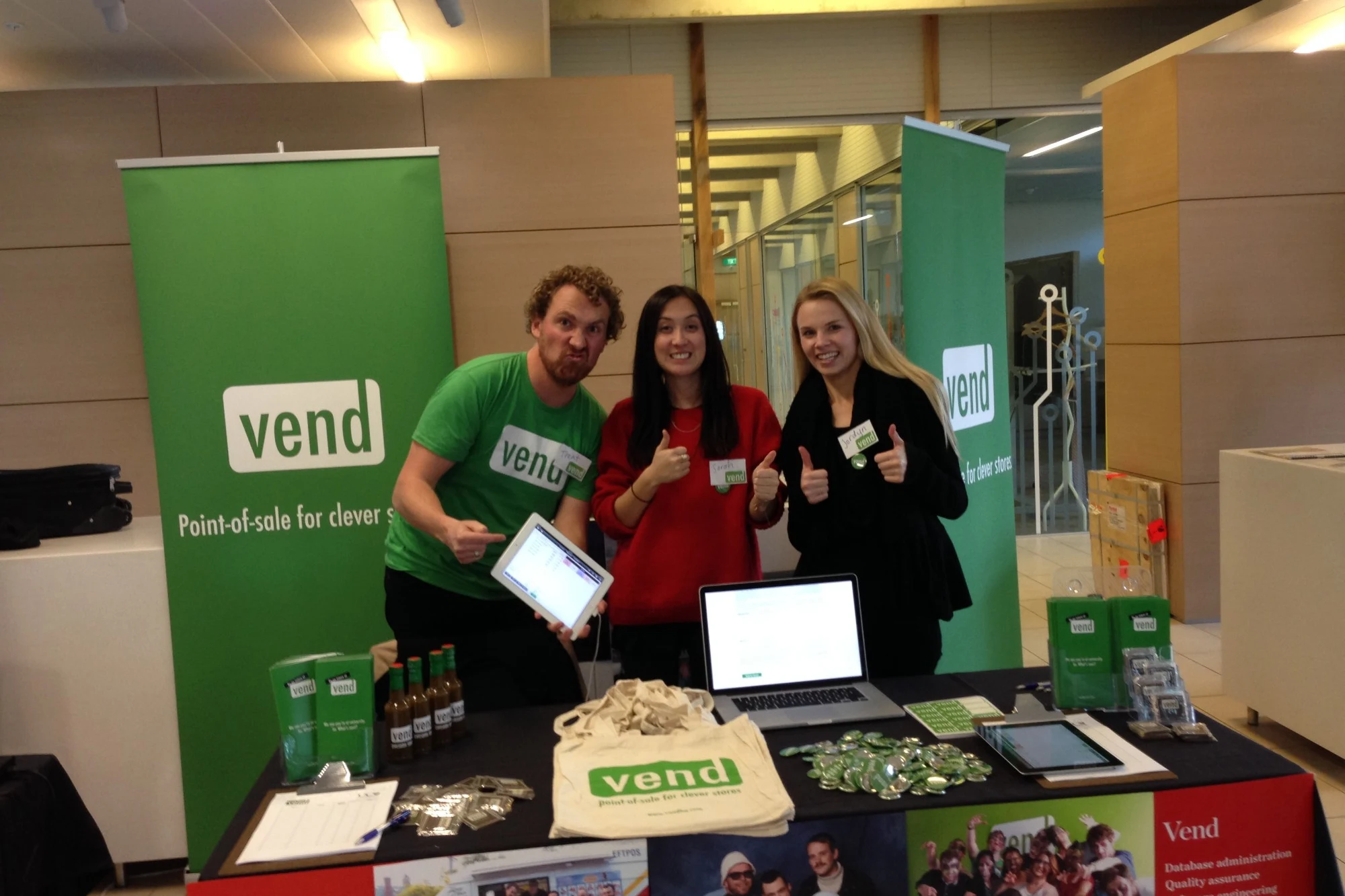 Trent, Sarah Hui and Jordyn Riley giving thumbs up at a Vend recruiting stand